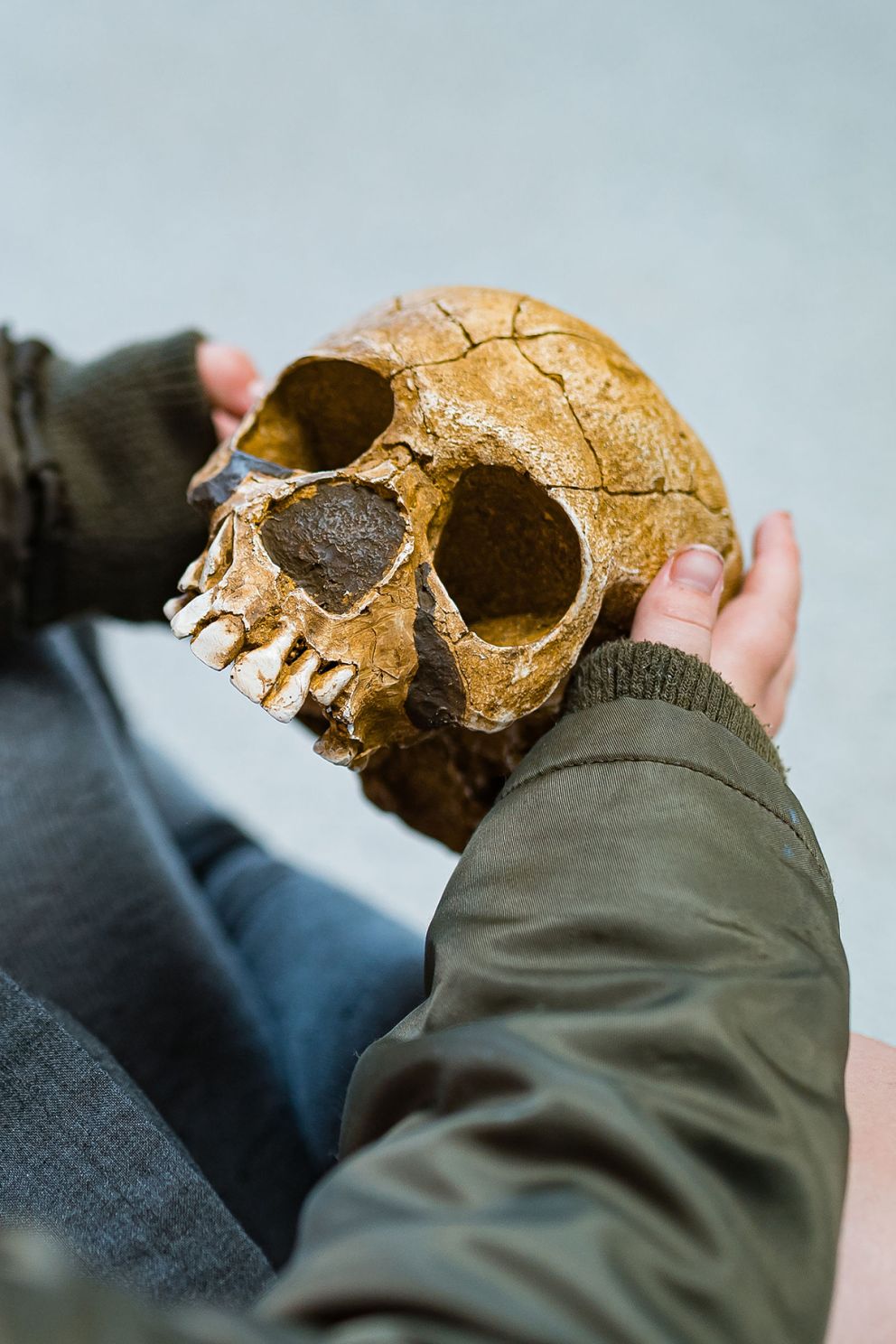 Child holding a skull replica at Kents Cavern, Torquay