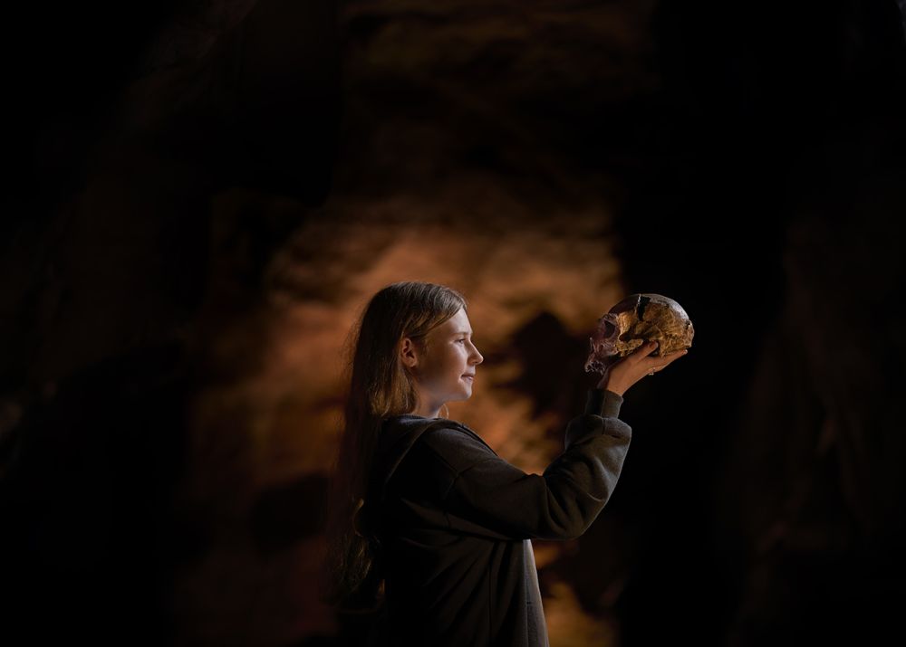 Child looking at Neanderthal skull | Kents Cavern, Devon
