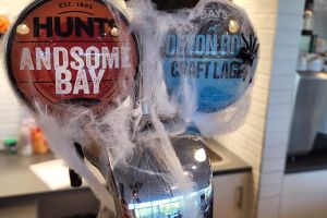 Halloween decorations on beer pumps, Kents Cavern, Torquay