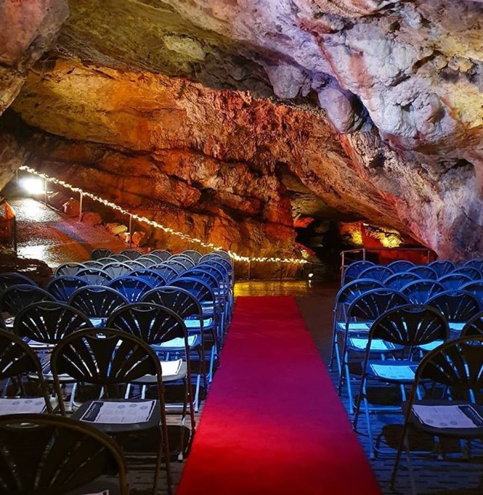 Chair theatre style set up in a Cave at Kents Cavern, Torquay