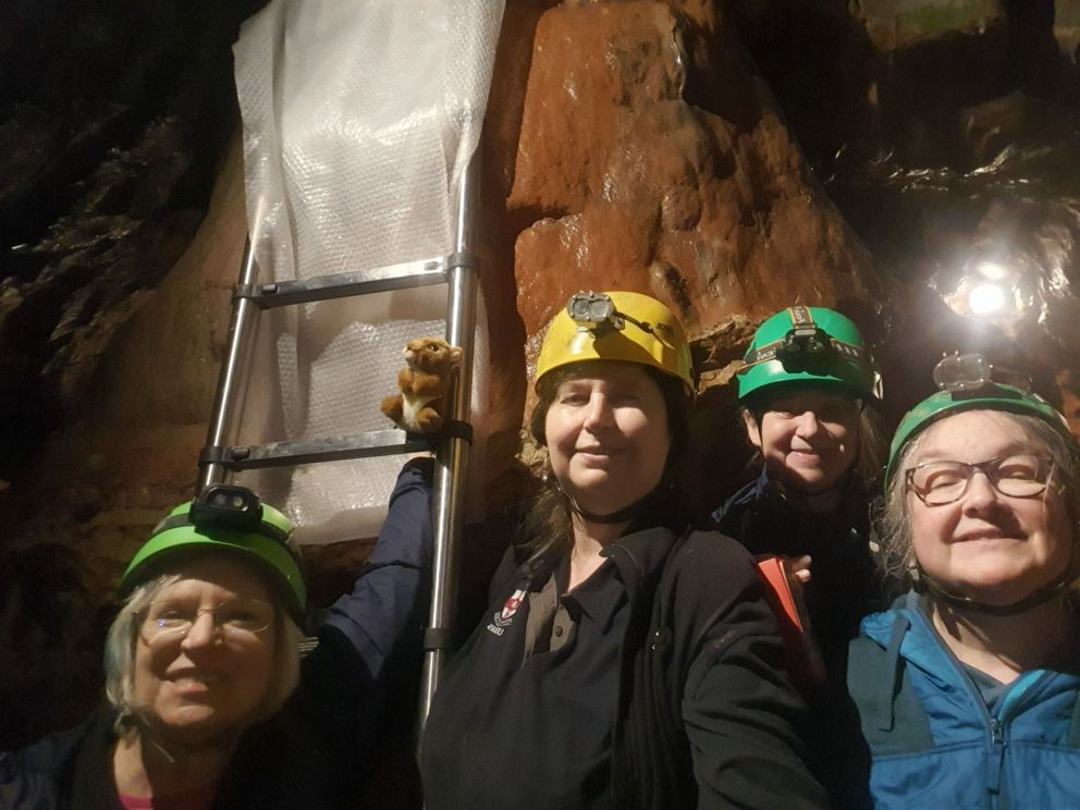 raking light team selfie in kents cavern